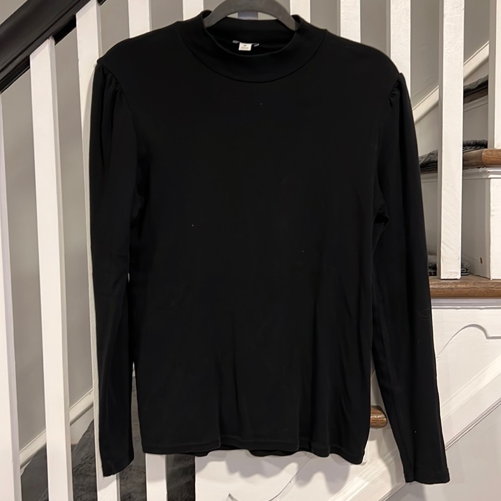 Mock turtle neck with slightly puckered shoulders